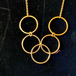 Vintage Avon gold toned 5 ring neck less